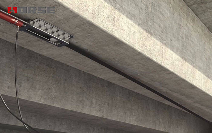 Prestressed FRP laminate system for bridge strengthening