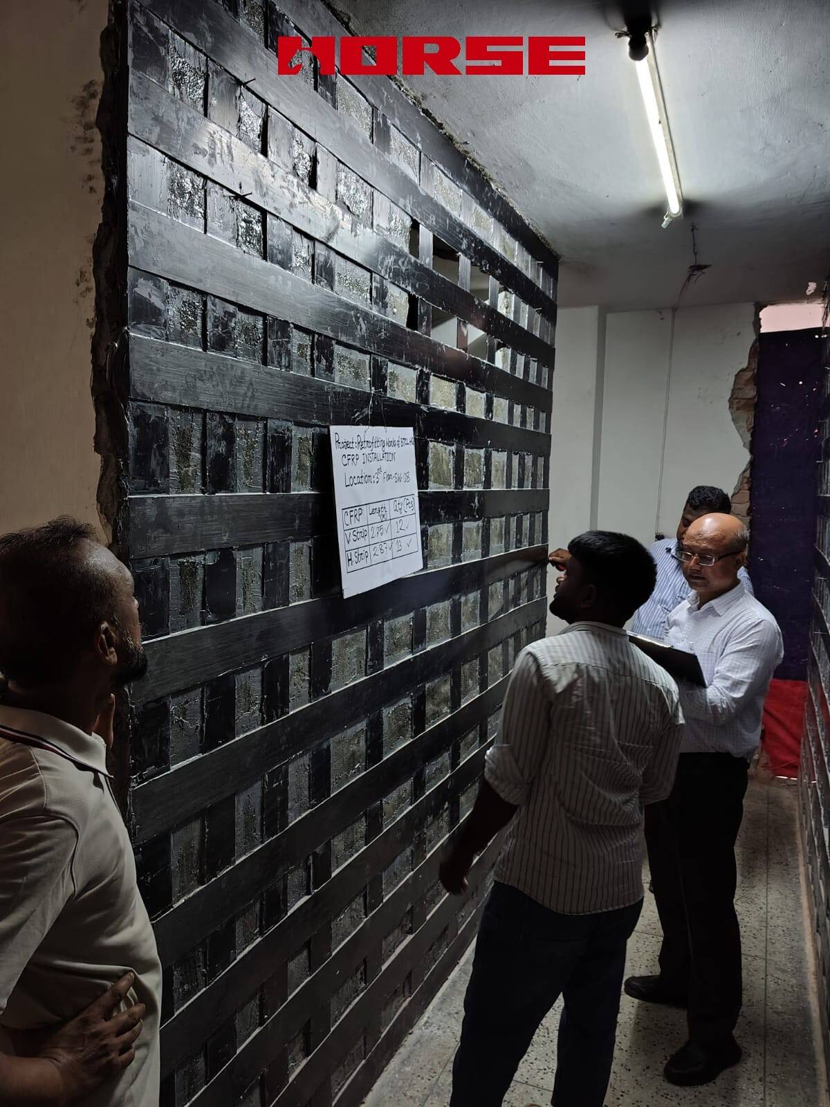 Retrofitting Concrete Walls Using CFRP Laminate